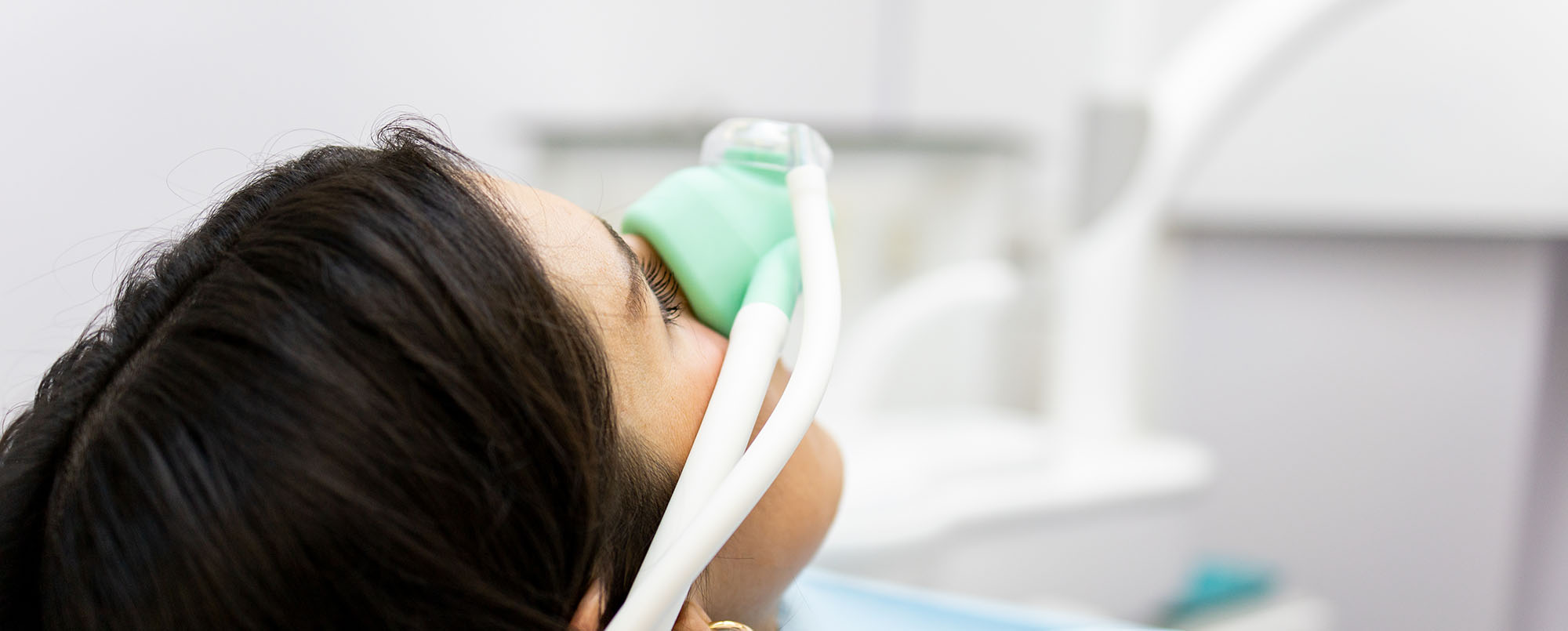 Woman undergoing sedation dentistry