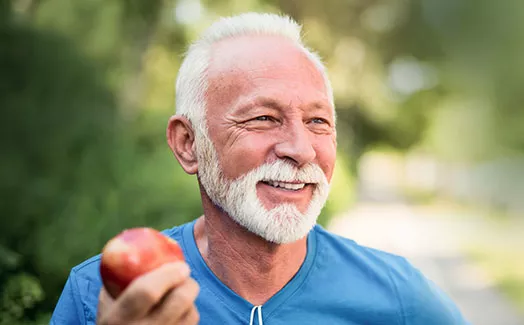 Man eating an apple