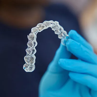 Holding Invisalign clear aligner